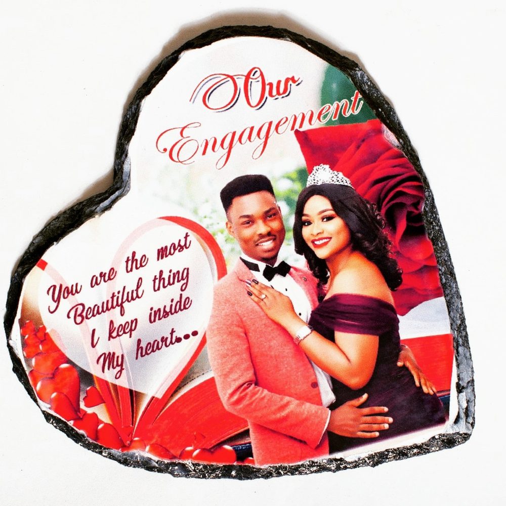 A heart-shaped photo slate with a rock edge, printed with a couple's portrait